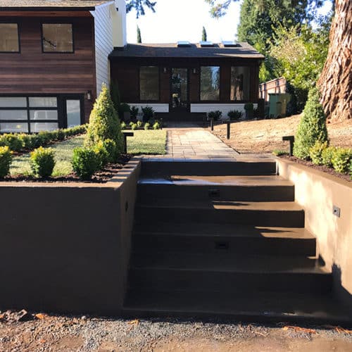 Modern home entrance with concrete steps for a home in Lake Oswego, Oregon