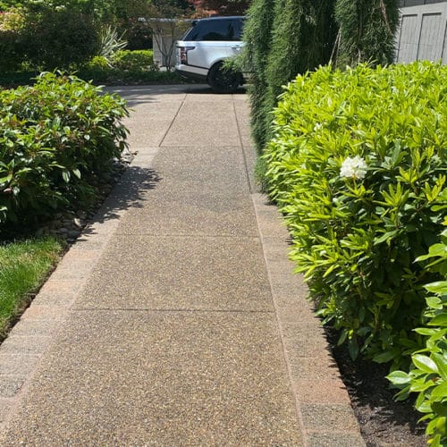 Aggregate walkway leading to residential home entrance