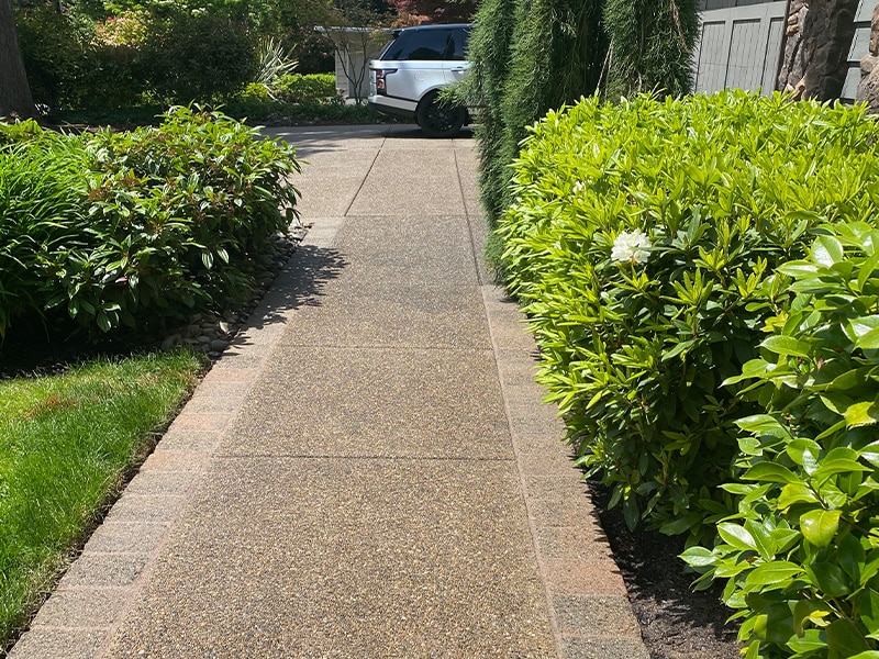 Aggregate walkway leading to residential home entrance