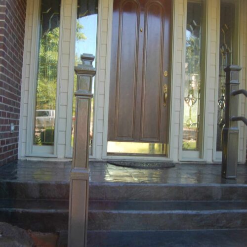 Handrails on stamped concrete steps