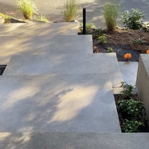 Top view of floating concrete steps out front of a Portland home