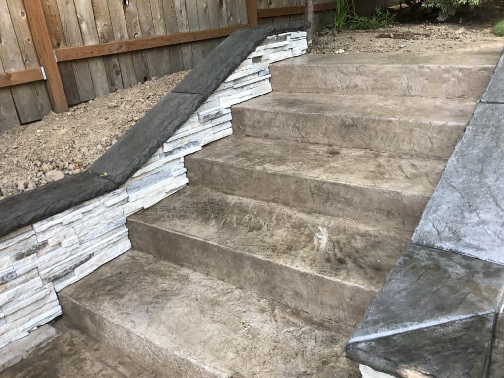 Retaining wall and stamped concrete walkway and steps