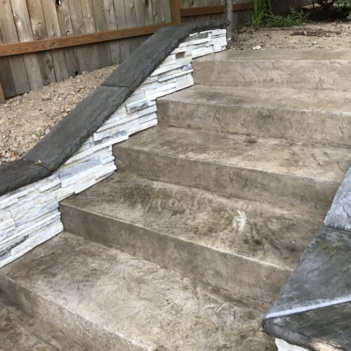 Retaining wall and stamped concrete walkway and steps