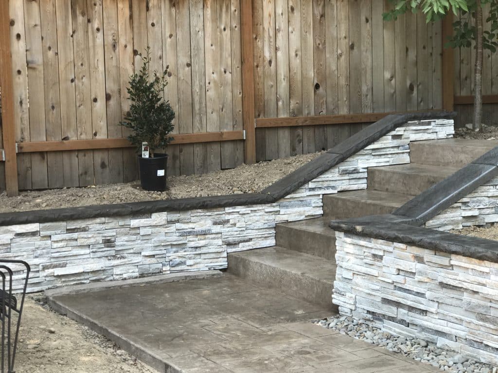 Retaining wall and stamped concrete walkway and steps