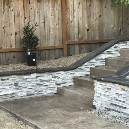 Retaining wall and stamped concrete walkway and steps