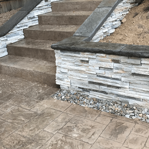 Retaining wall and stamped concrete walkway and steps