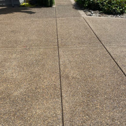 Exposed aggregate concrete finish with color
